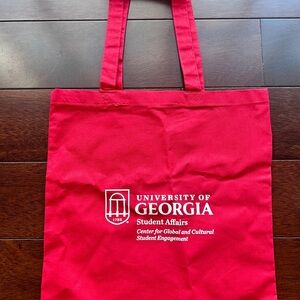 Red Canvas Tote Bag branded with the UGA logo